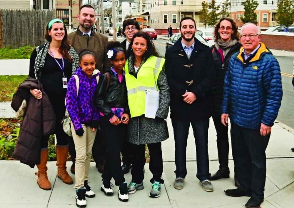 On the way to school (back, left to right): Stephanie Hague, Family Service of RI; School Superintendent Chris Maher; Rabbi Barry Dolinger, Congregation Beth Sholom; Rabbi Elan Babchuck, Temple Emanu-El; Rabbi Sarah Mack, Temple Beth-El; Rabbi Wayne Franklin, Temple Emanu-El; Front row: two students from Fogarty Elementary School; Joyce Leven, Family Service of RI. /Photo | Stephen Hug